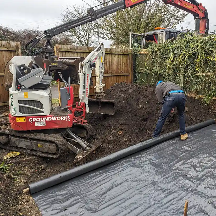 Digger and muck grabber working
