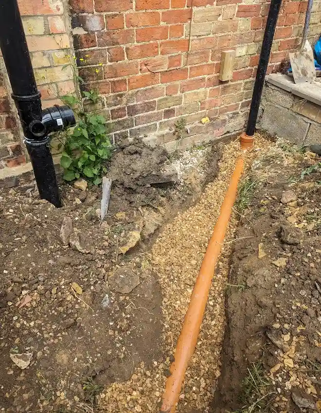 Drainpipe into drainage in shingle